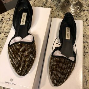 Dazzling black suede flats with gold details